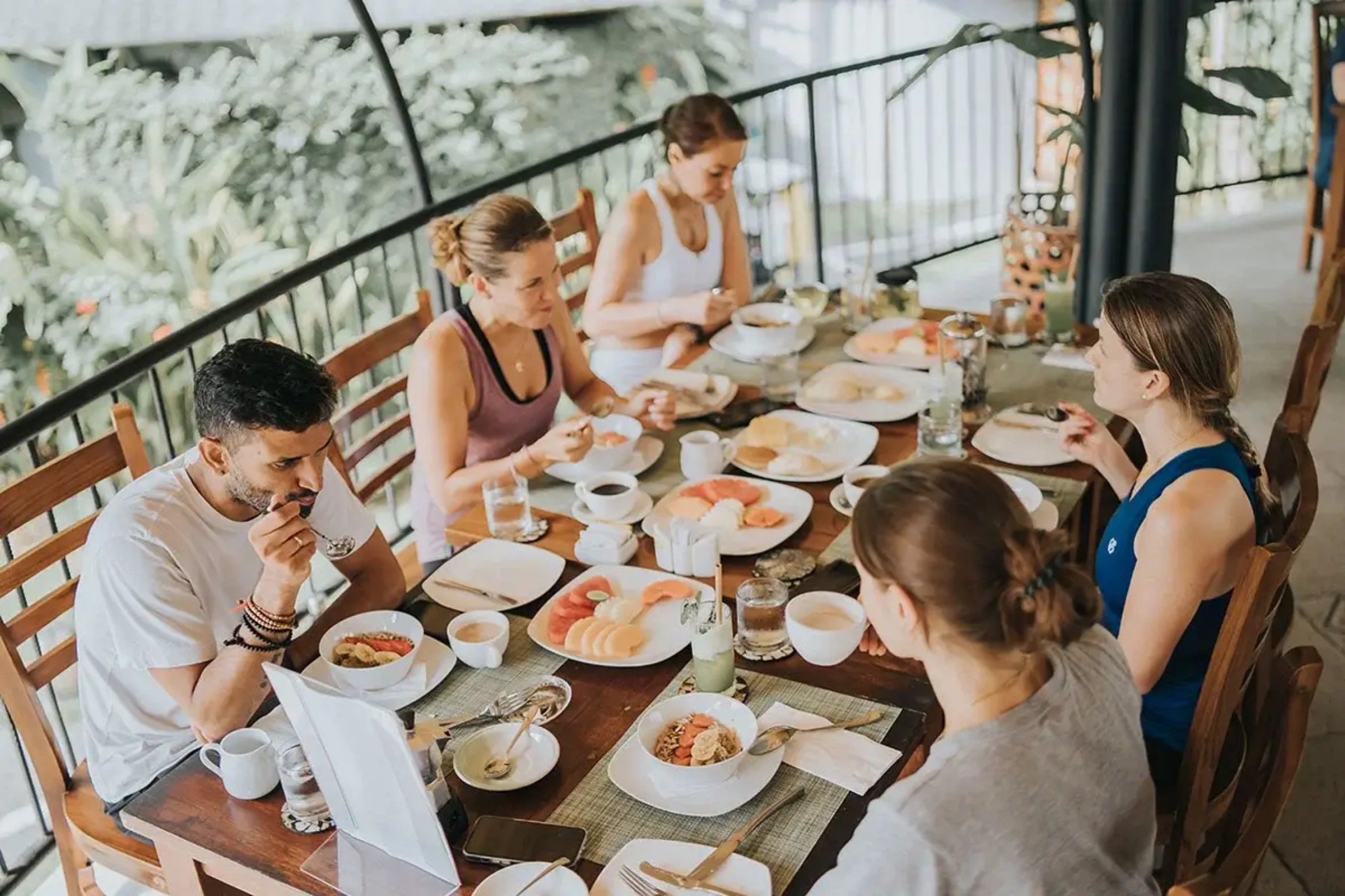 Dining together during yoga and meditation retreat in Bali